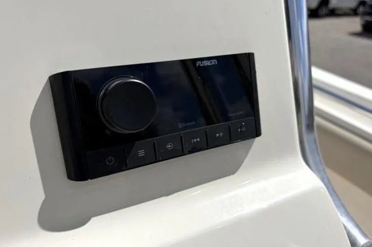 Slide: The Image of 2024 Key West 239 FS boat featuring a Fusion audio control panel. - 27