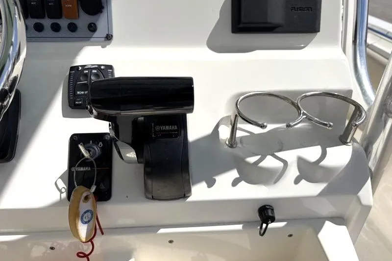 Slide: The Image of 2024 Key West 239 FS boat console with Yamaha controls and cup holders. - 29
