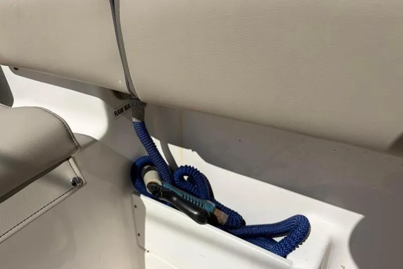 Slide: The Image of 2024 Key West 239 FS boat interior with blue rope and storage compartment. - 38