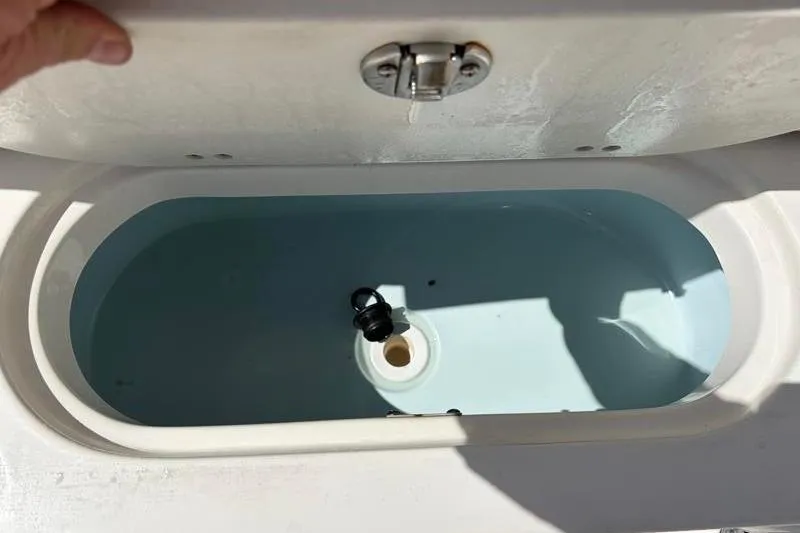 Slide: The Image of 2024 Key West 239 FS boat livewell with open lid, showcasing interior design. - 39