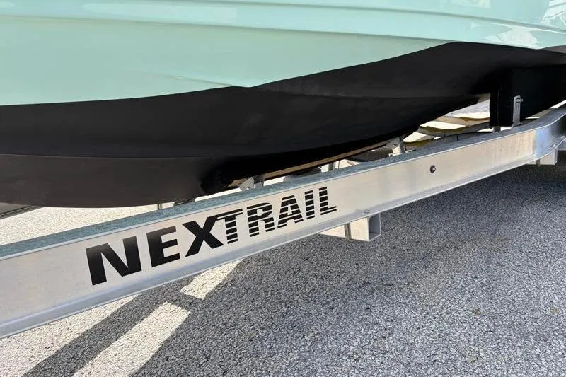 Slide: The Image of 2024 Key West 239 FS boat on NexTrail trailer, close-up view. - 41