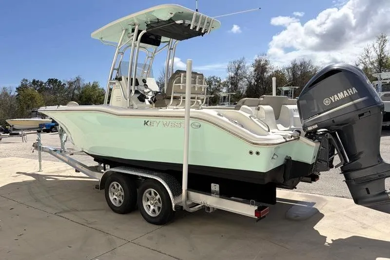Slide: The Image of 2024 Key West 239 FS boat on trailer with Yamaha outboard motor. - 6