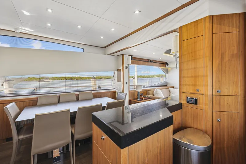 Slide: The Image of Luxurious interior of 2014 Sunseeker 73 Manhattan yacht with dining area and modern wood finishes. - 18