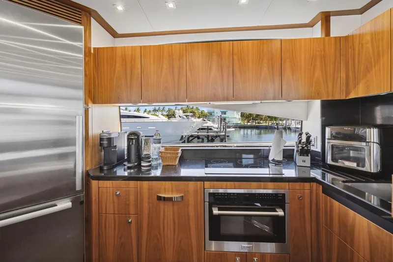 Slide: The Image of Luxurious kitchen interior of 2014 Sunseeker 73 Manhattan yacht with modern appliances and waterfront view. - 20