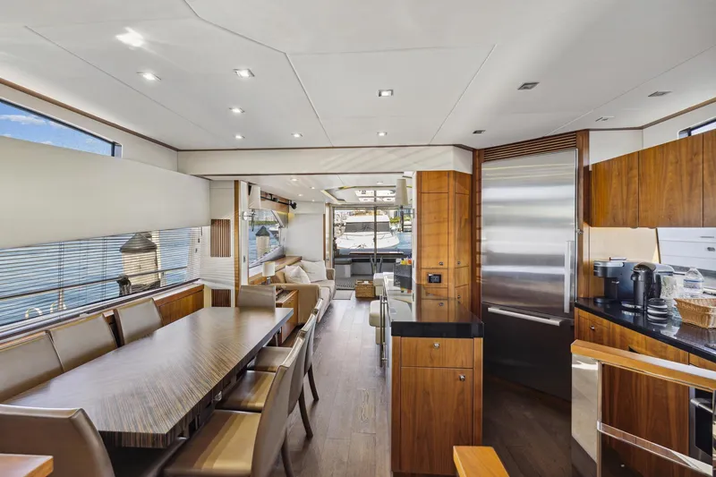 Slide: The Image of Luxurious interior of 2014 Sunseeker 73 Manhattan yacht with modern dining and kitchen area. - 21