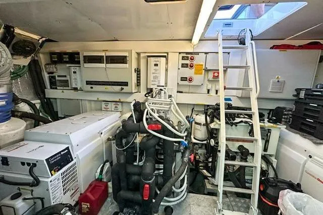 Slide: The Image of Engine room of 2014 Sunseeker 73 Manhattan yacht with equipment and ladder access. - 40