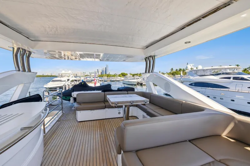 Slide: The Image of Luxurious 2014 Sunseeker 73 Manhattan yacht interior with spacious seating and scenic marina view. - 7