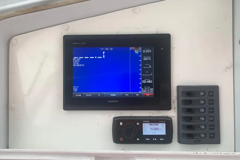 Slide: The Image of Garmin GPS display and control panel on 1999 Hatteras 52 Cockpit Motor Yacht. - 11