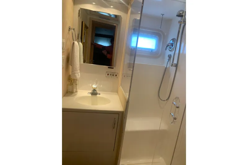 Slide: The Image of Bathroom interior of 1999 Hatteras 52 Cockpit Motor Yacht with shower and sink. - 27