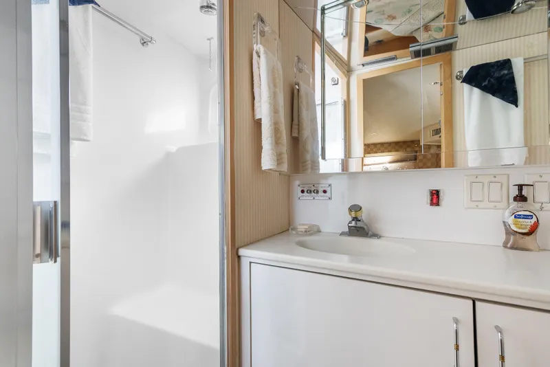 Slide: The Image of Bathroom interior of 1999 Hatteras 52 Cockpit Motor Yacht with sink and shower. - 31