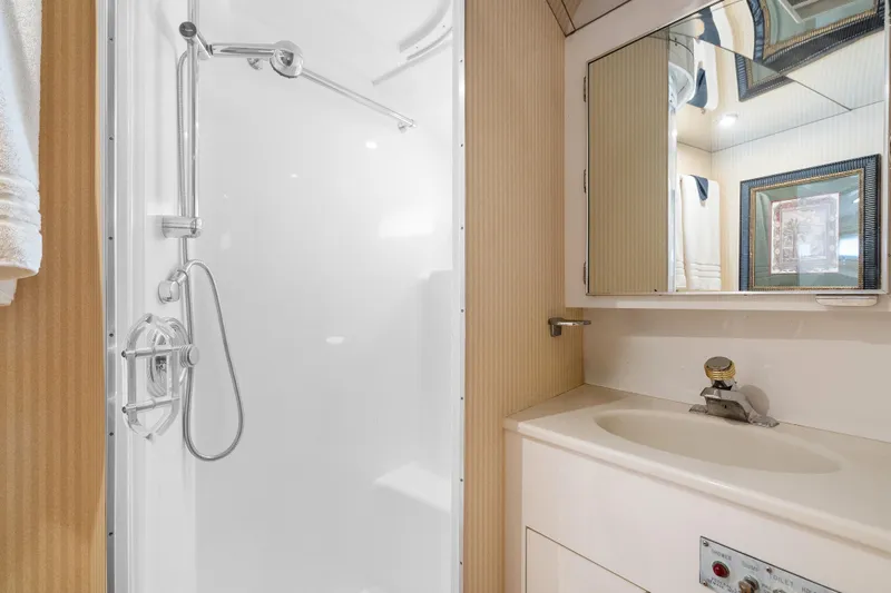 Slide: The Image of Bathroom interior of 1999 Hatteras 52 Cockpit Motor Yacht with shower and vanity. - 33