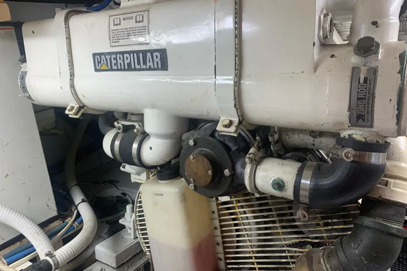 Slide: The Image of Engine room of 1999 Hatteras 52 Cockpit Motor Yacht with Caterpillar components. - 36