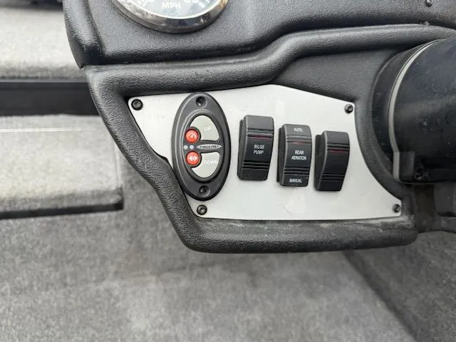 Slide: The Image of Control panel of a 2023 Ranger RT178 boat with switches. - 19
