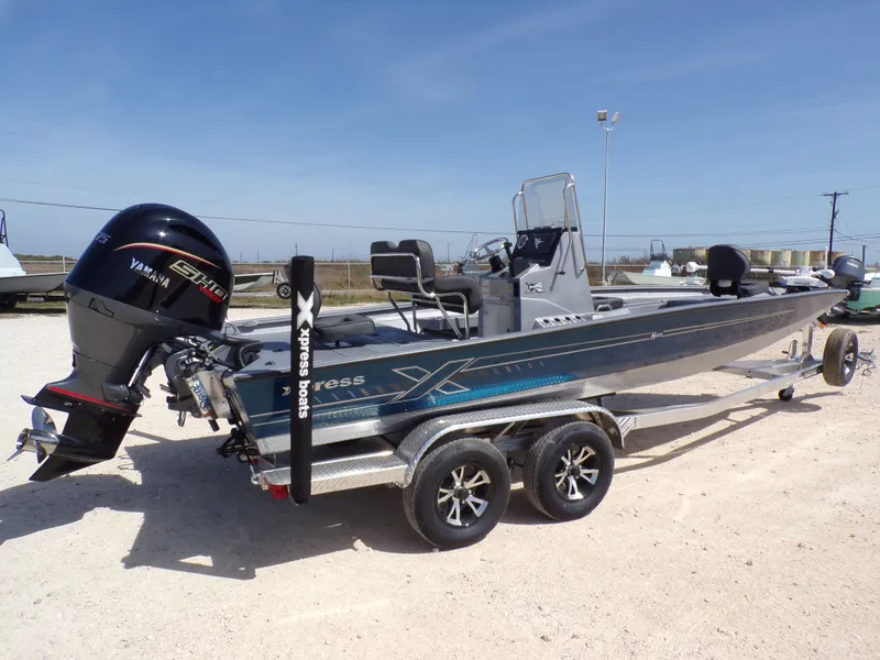 Slide: The Image of 2026 Xpress H22B Bay boat with Yamaha engine on trailer. - 21