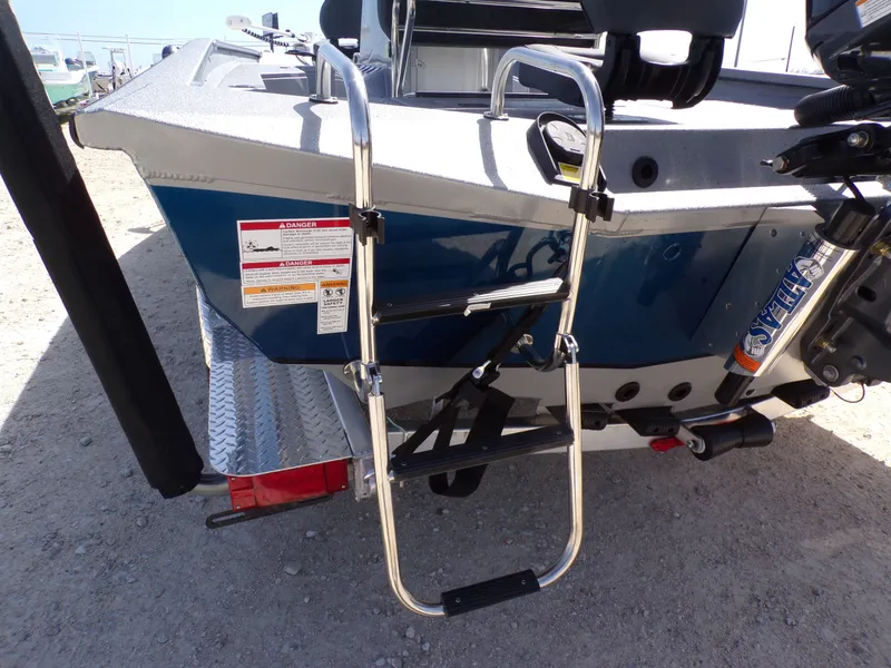 Slide: The Image of 2026 Xpress H22B Bay boat with ladder and motor. - 22