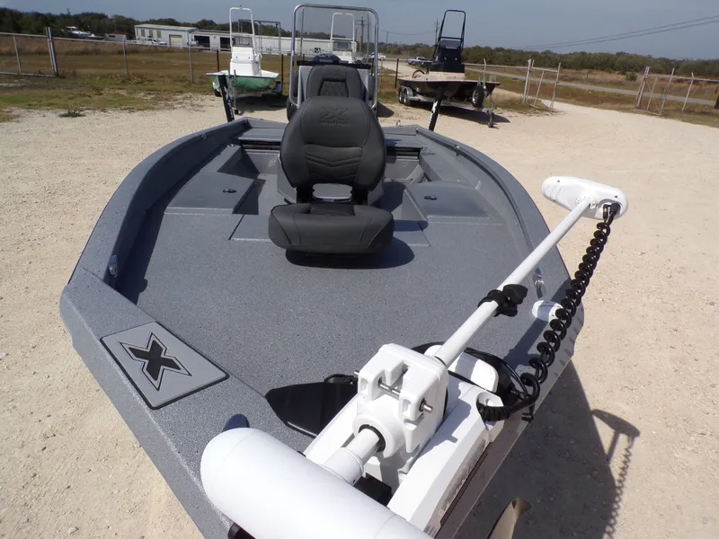 Slide: The Image of 2026 Xpress H22B Bay boat on a gravel lot. - 23