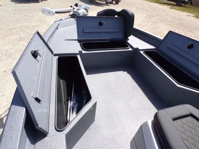 Slide: The Image of 2026 Xpress H22B Bay boat with storage compartments and seating. - 25