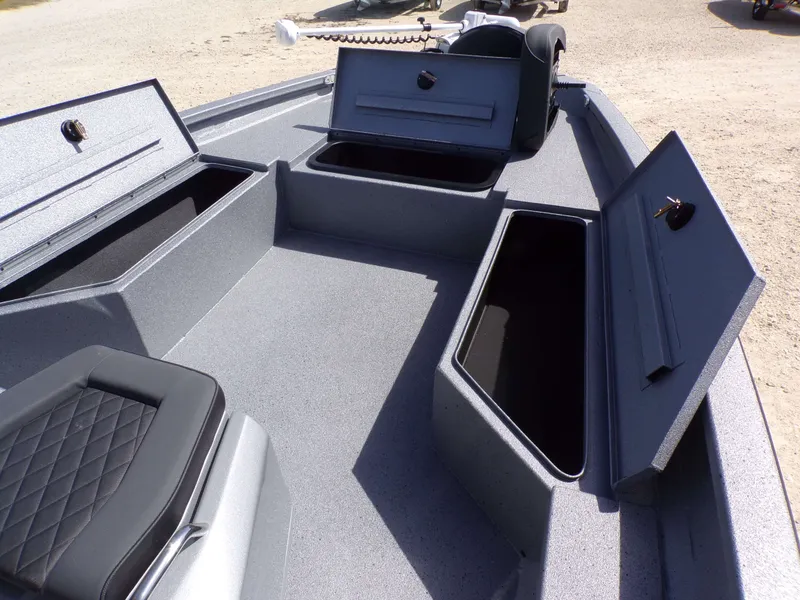 Slide: The Image of 2026 Xpress H22B Bay boat with open storage compartments. - 26