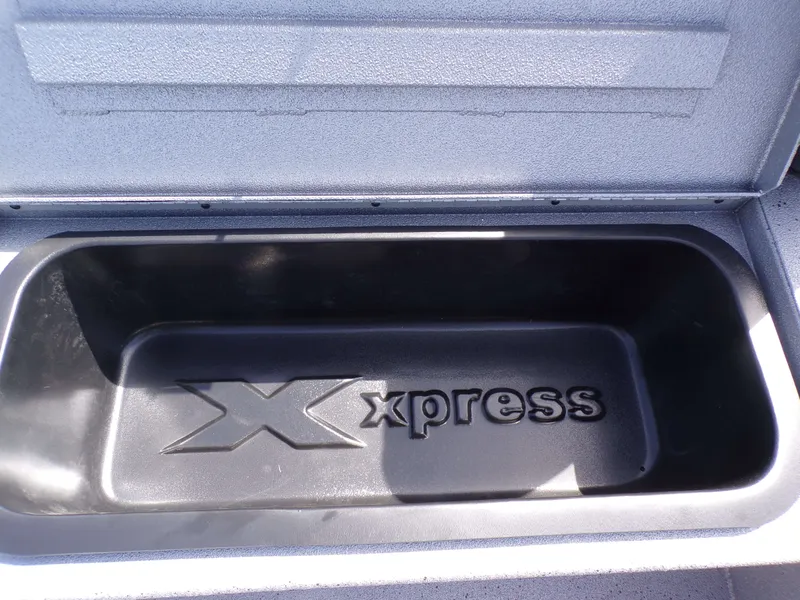 Slide: The Image of Xpress H22B Bay 2026 storage compartment with logo. - 27