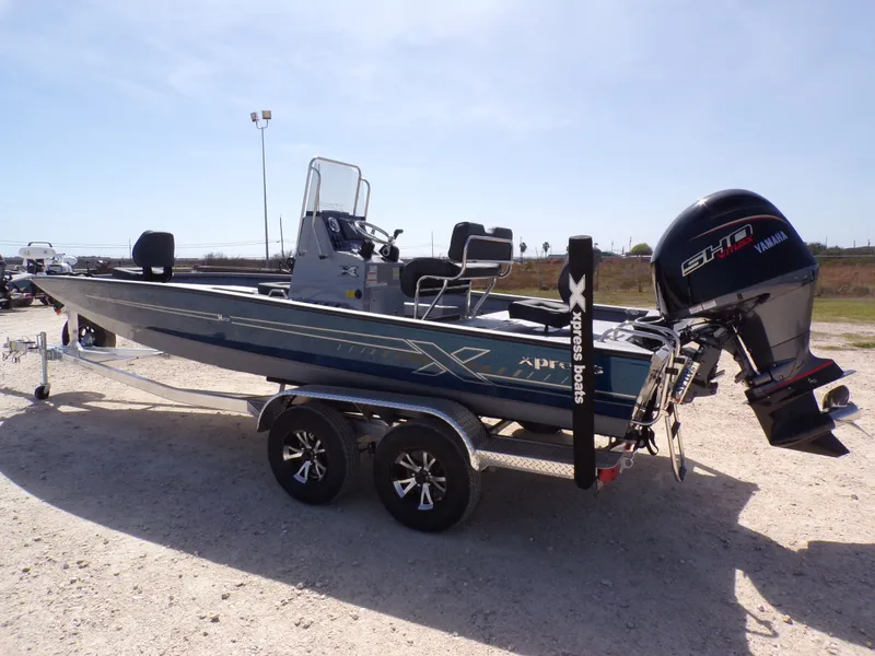 Slide: The Image of 2026 Xpress H22B Bay boat with Yamaha motor on trailer. - 6