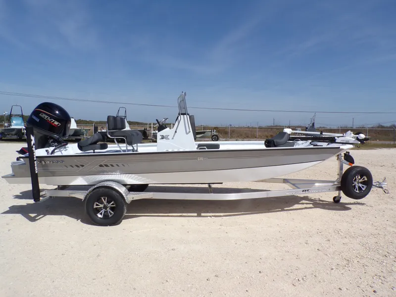 Slide: The Image of 2026 Xpress SW20B boat on trailer, side view. - 10
