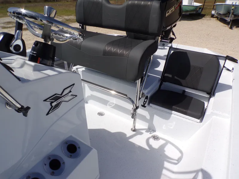 Slide: The Image of Interior of Xpress SW20B boat, 2026 model, featuring modern seating. - 24