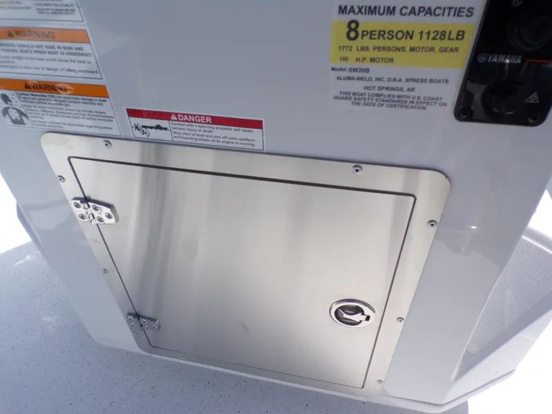 Slide: The Image of Xpress SW20B boat hatch with warning labels, 2026 model. - 31