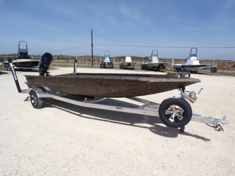Slide: The Image of 2026 Xpress X18DB boat on trailer outdoors. - 10