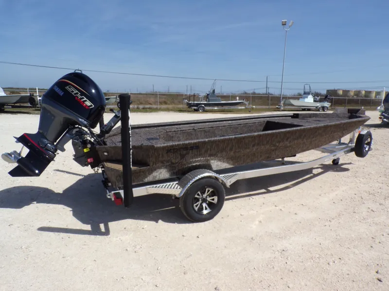 Slide: The Image of 2026 Xpress X18DB boat with outboard motor on trailer. - 11