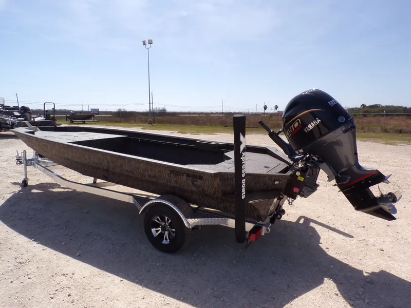 Slide: The Image of 2026 Xpress X18DB boat with Yamaha outboard motor. - 14