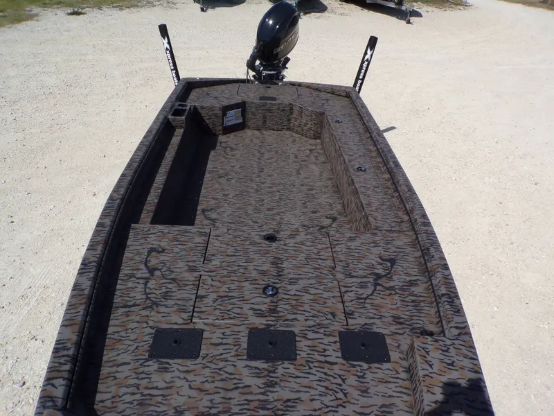 Slide: The Image of 2026 Xpress X18DB boat with camouflage pattern and outboard motor. - 16