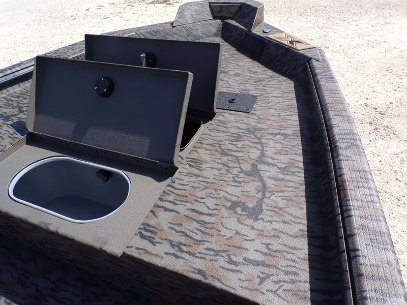 Slide: The Image of 2026 Xpress X18DB boat with storage compartments and camouflage pattern. - 17