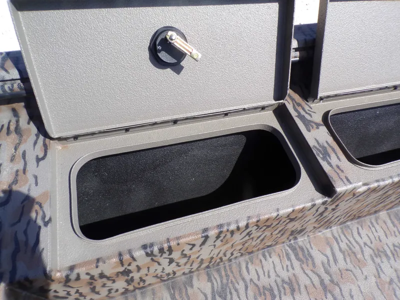 Slide: The Image of Xpress X18DB 2026 boat storage compartment with camouflage pattern. - 24