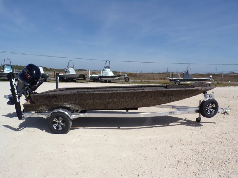 Slide: The Image of 2026 Xpress X18DB boat on trailer outdoors. - 3