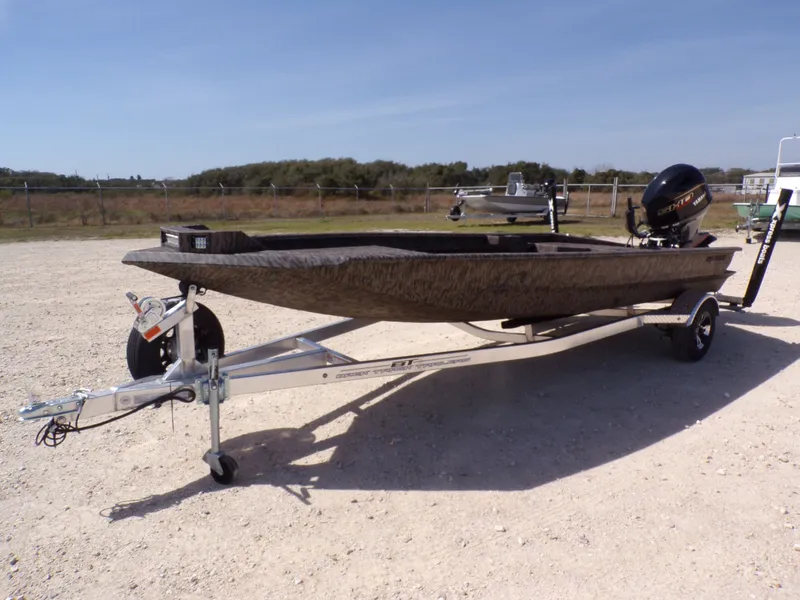 Slide: The Image of 2026 Xpress X18DB boat parked on trailer outdoors. - 8