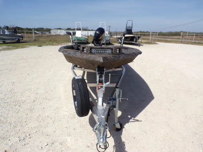 Slide: The Image of 2026 Xpress X18DB boat on trailer in sunny setting. - 9