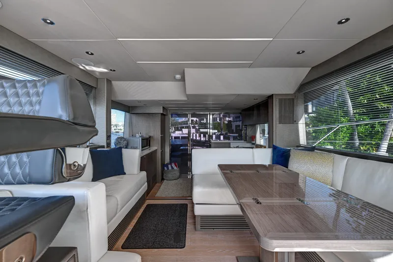 Slide: The Image of Luxurious interior of 2020 Sunseeker Manhattan 52 yacht with modern seating and dining area. - 24