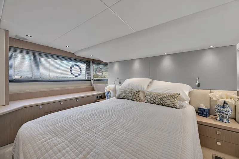 Slide: The Image of Luxurious bedroom interior of 2020 Sunseeker Manhattan 52 yacht, featuring elegant decor and ample natural light. - 37