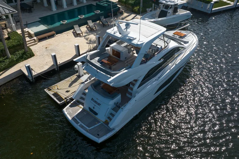 Slide: The Image of Luxury Sunseeker Manhattan 52 yacht docked by waterfront villa, 2020 model. - 5