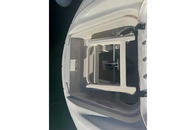Slide: The Image of 2005 Sea Ray 240 Sundeck boat ladder, white, folded, top view. - 5