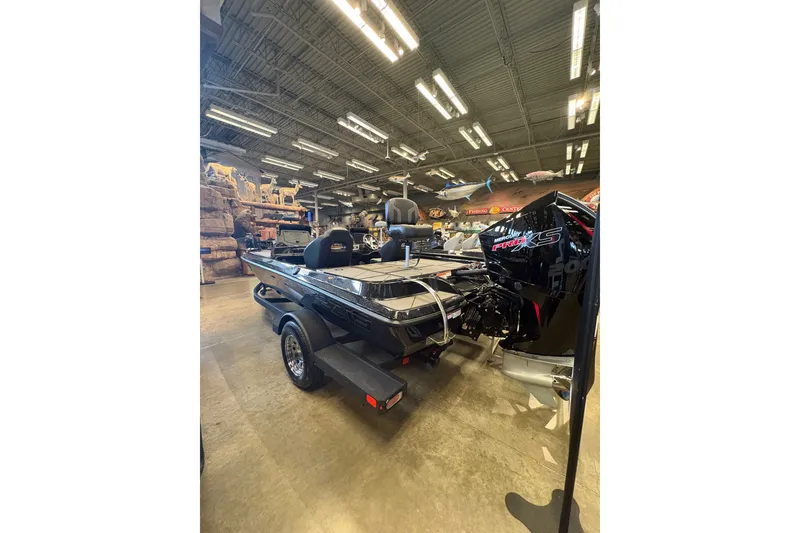 Slide: The Image of 2026 Nitro Z19 XL boat displayed indoors with powerful engine and sleek design. - 98