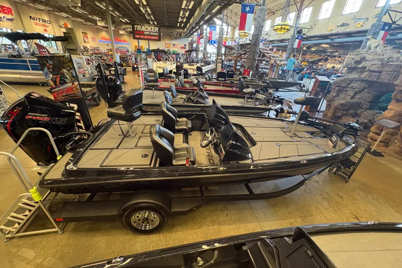Slide: The Image of 2026 Nitro Z19 XL boat displayed in a showroom with modern design and seating. - 3