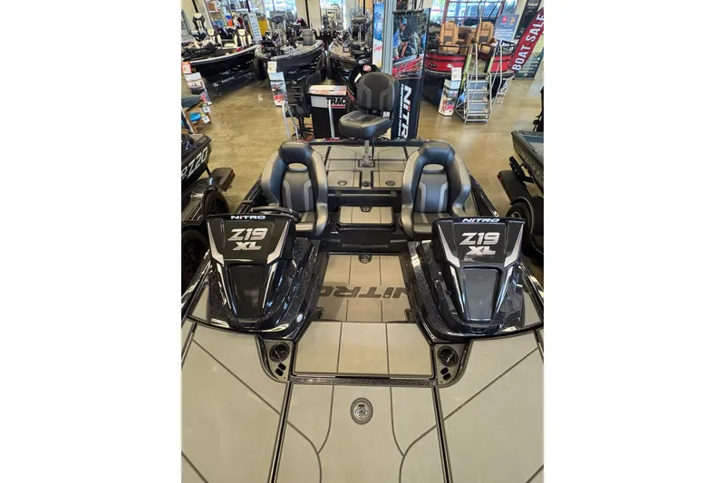 Slide: The Image of 2026 Nitro Z19 XL boat interior with dual seats in showroom display. - 9
