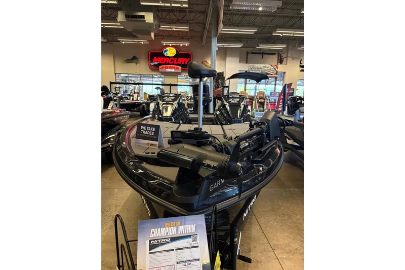 The Image of 2026 Nitro Z19 XL boat displayed in showroom with Mercury Power sign. - 0