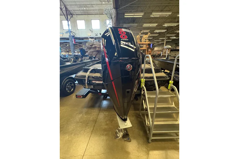 Slide: The Image of 2026 Nitro Z19 XL boat with powerful outboard motor displayed indoors. - 5