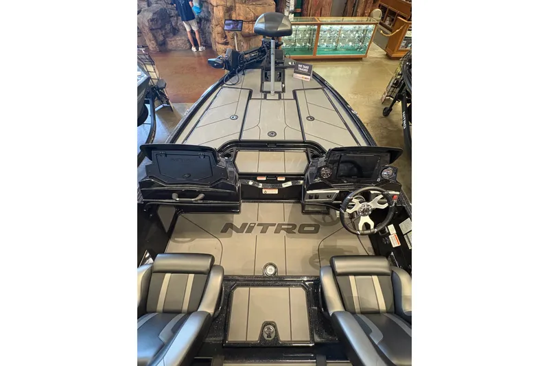 Slide: The Image of 2026 Nitro Z19 XL boat interior with steering wheel and seating, displayed indoors. - 10