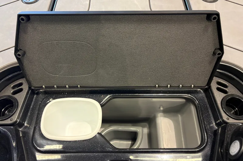 Slide: The Image of Open storage compartment in 2026 Nitro Z19 XL boat, featuring a built-in cooler. - 17