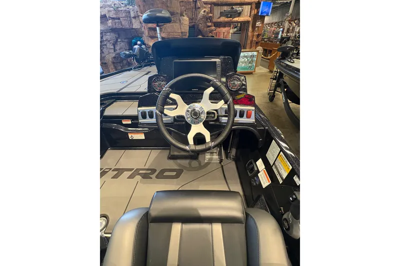 Slide: The Image of 2026 Nitro Z19 XL boat cockpit with steering wheel and control panel. - 11