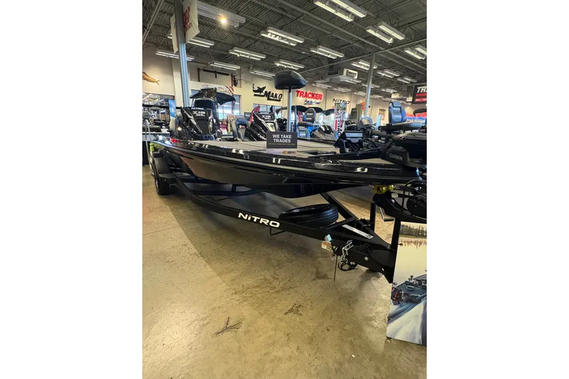 Slide: The Image of 2026 Nitro Z19 XL boat displayed in showroom, featuring sleek design and advanced technology. - 1