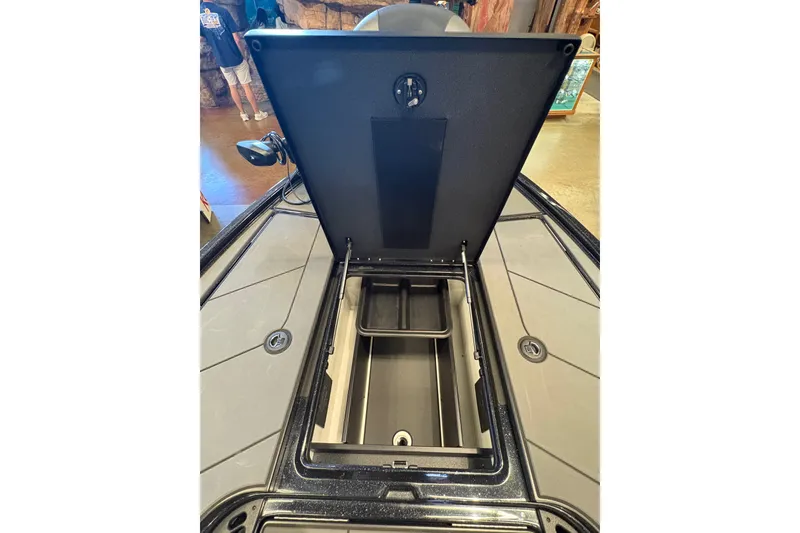 Slide: The Image of Open storage compartment on 2026 Nitro Z19 XL boat, showcasing interior design. - 12
